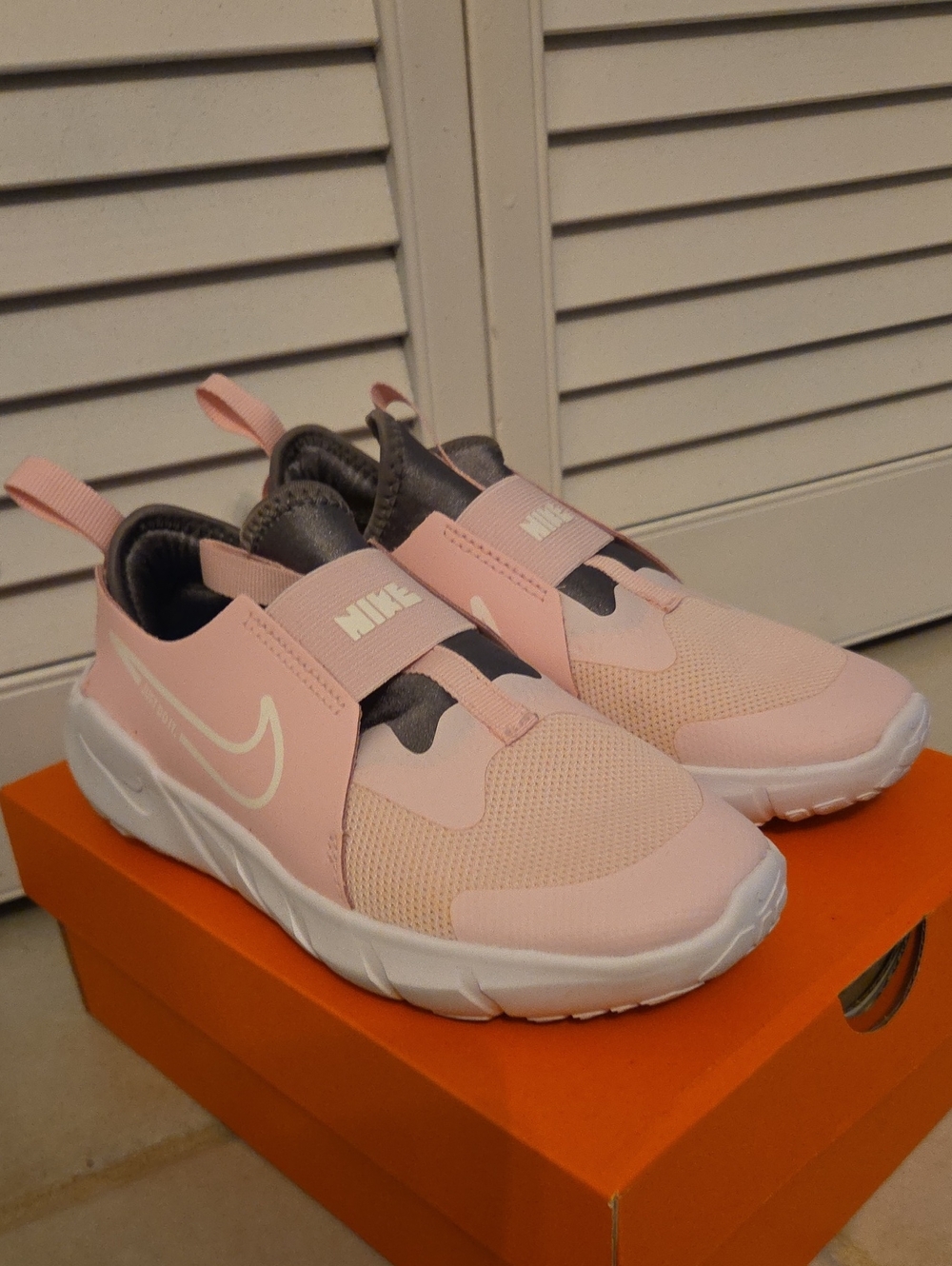 Nike Kids Slip-On Sneakers in Light Pink and White